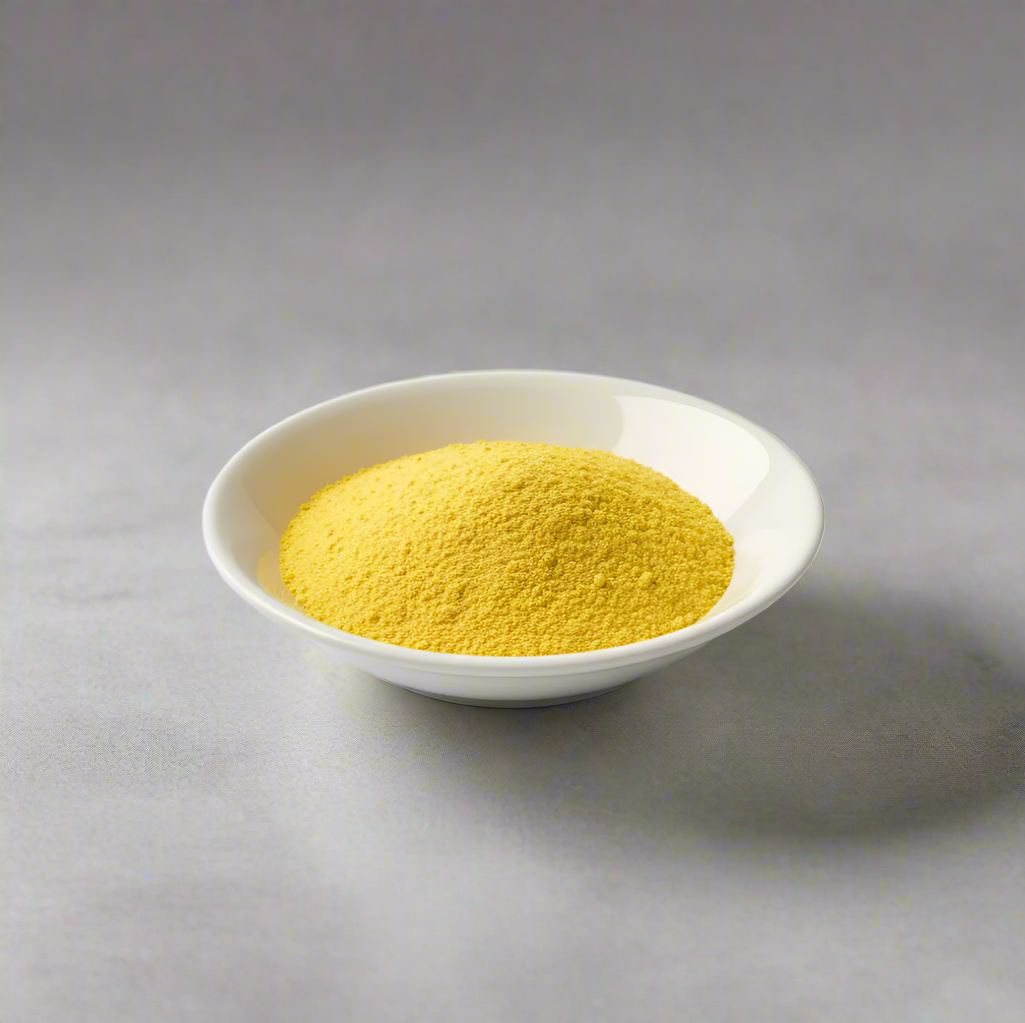 Pure mango powder freeze dried in a white bowl