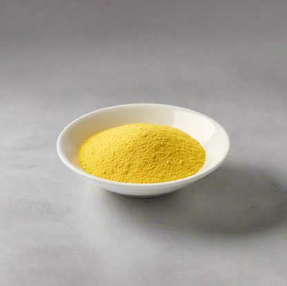 Pure mango powder freeze dried in a white bowl